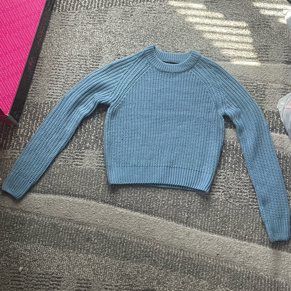 Blue knit sweater, silver button design on the back